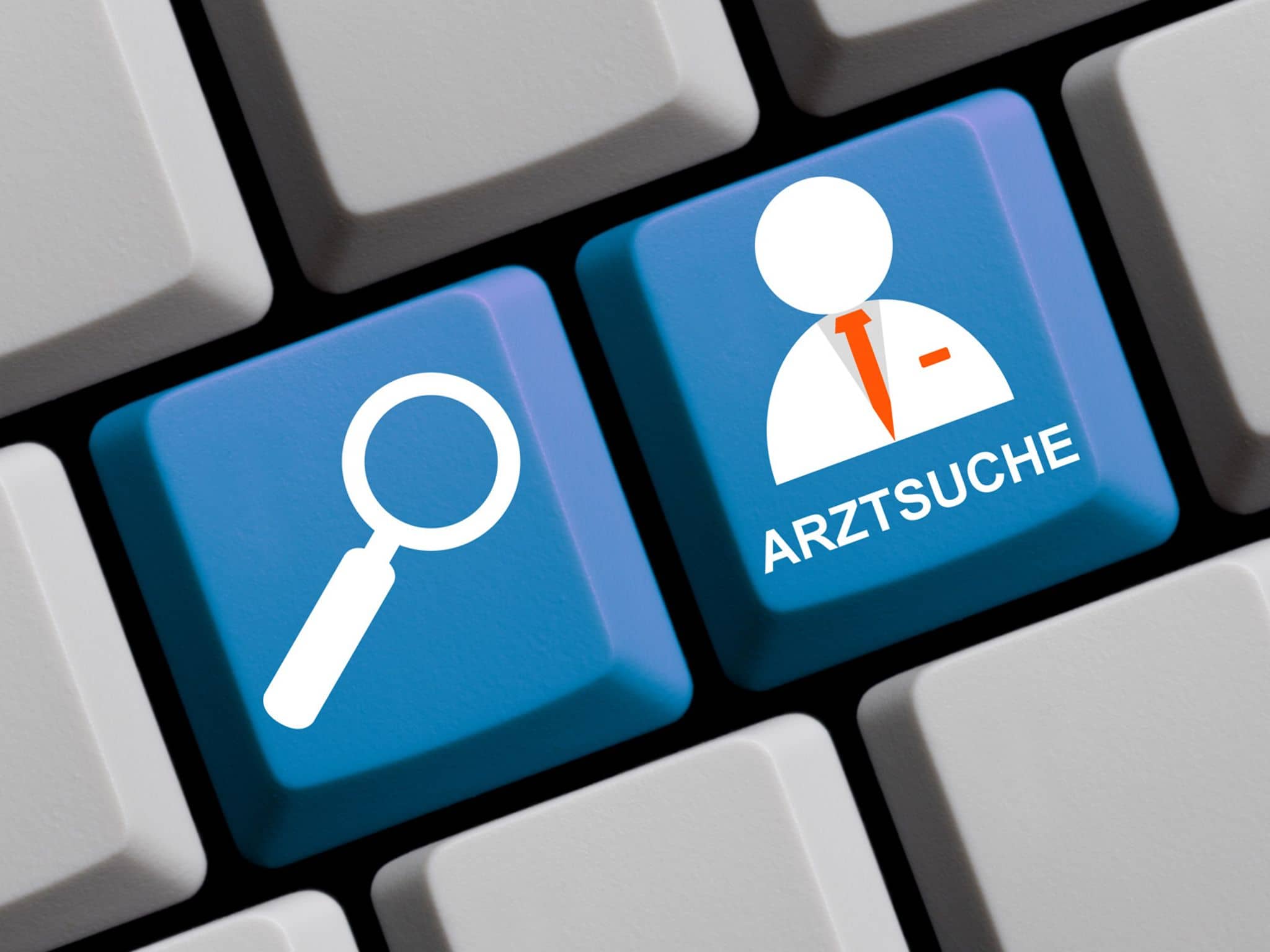 Computer-Tastatur mit Symbolen, die eine Lupe und das Wort Arztsuche zeigen