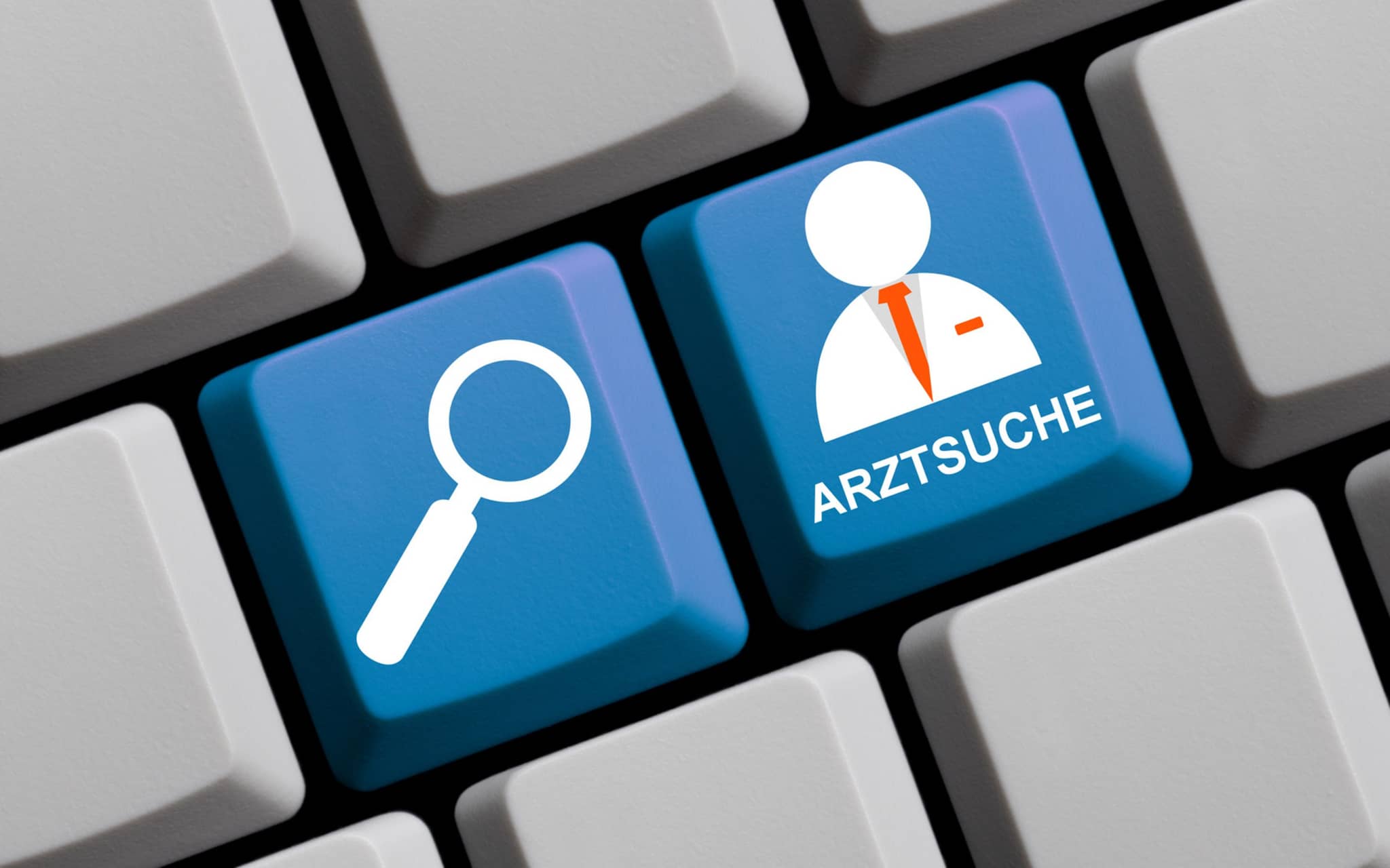Computer-Tastatur mit Symbolen, die eine Lupe und das Wort Arztsuche zeigen