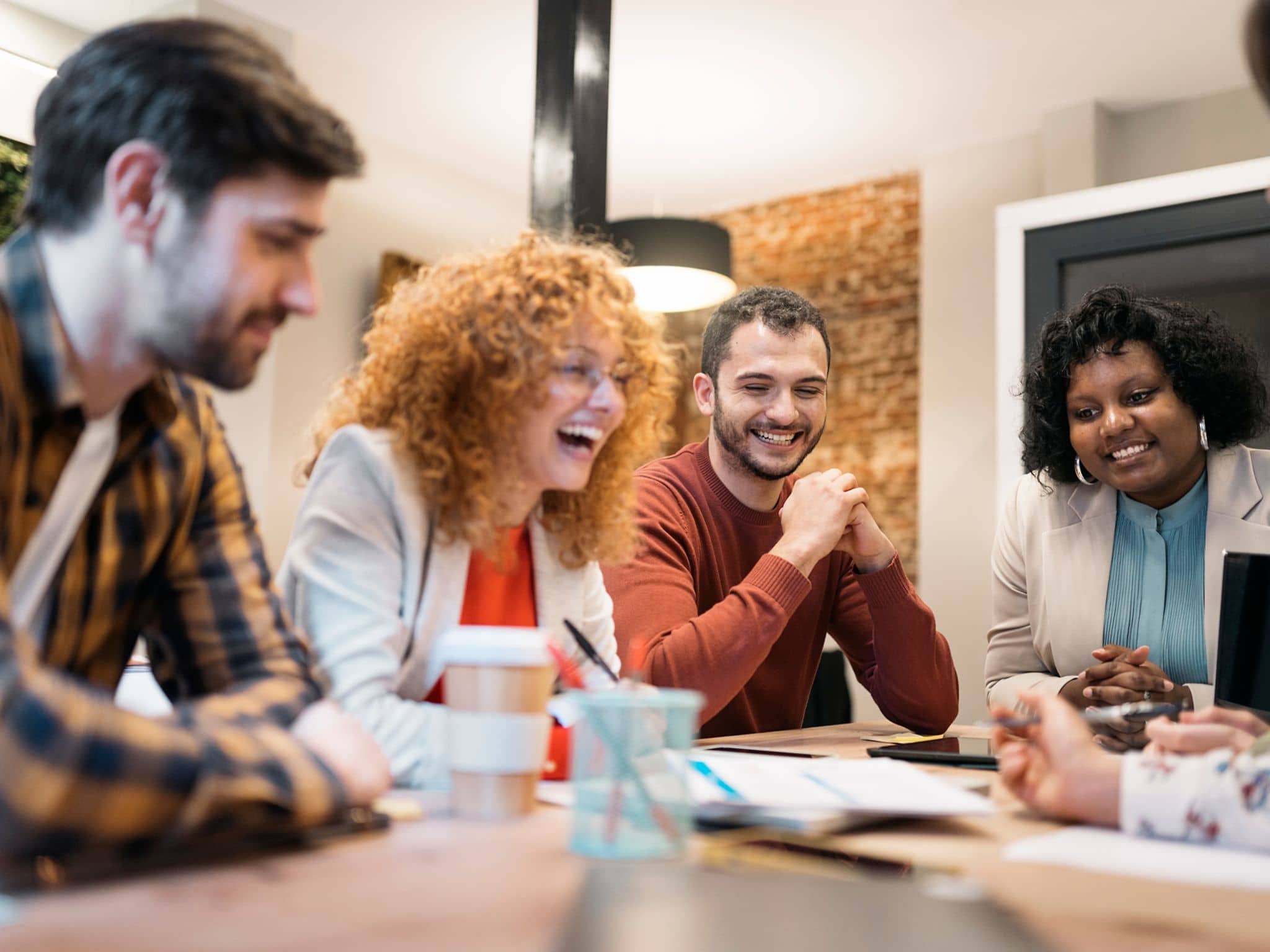 A group of colleauges talking in a meeting.
